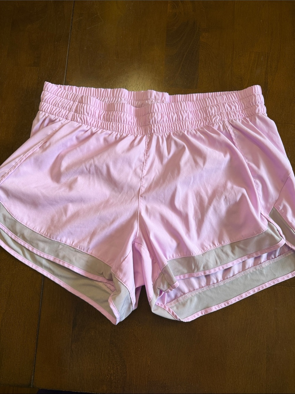 Athleta Light Pink Athletic Shorts with Gray mesh trim, medium.